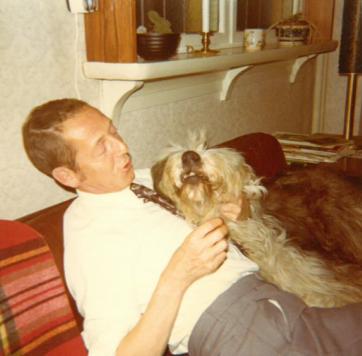 Photo of C.C. and the dog named Shaggy, in the sofa